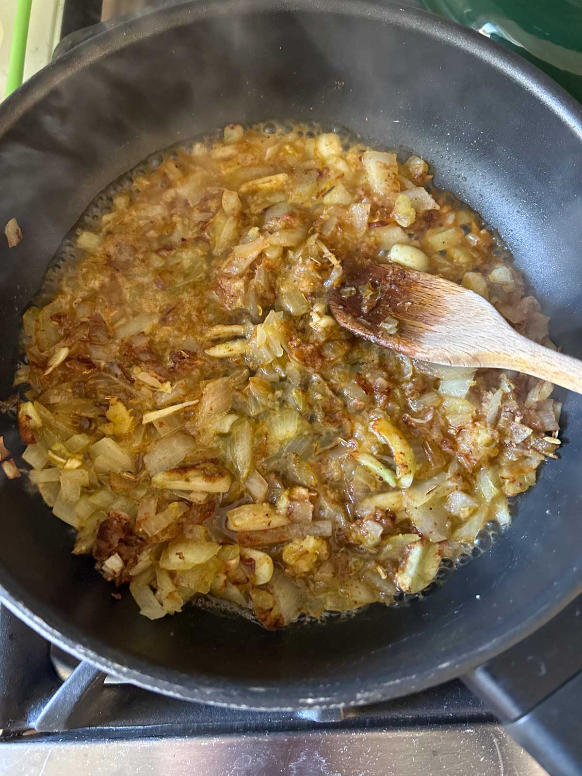 Stir lemon juice into the sauteed onions, garlic, ginger and spices