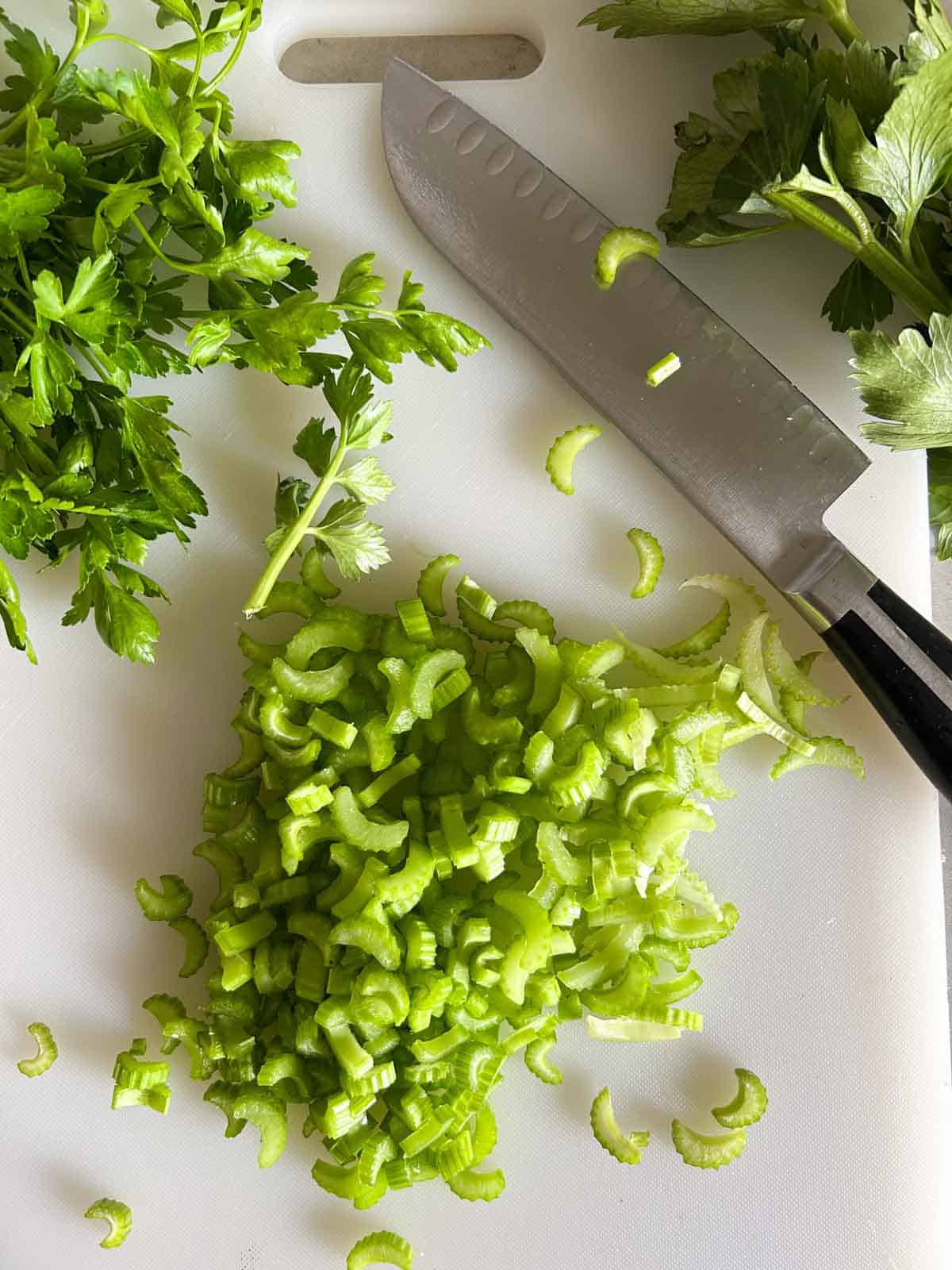Cut celery and celery leaves into uniform pieces