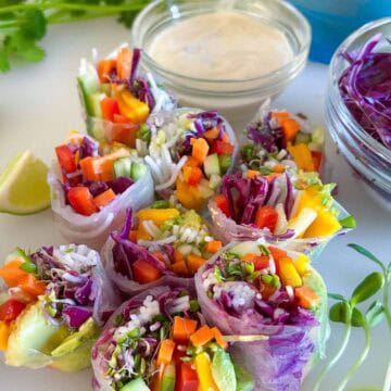 Fresh veggie summer rolls with tahini dipping sauce ready to eat